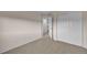 Bedroom features neutral walls, carpet, and closet with double doors at 2587 S Flanders Ct, Aurora, CO 80013