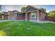 Beautiful home with green lawn, brick and siding exterior, and attached garage, situated in a residential neighborhood at 2587 S Flanders Ct, Aurora, CO 80013