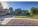 Traditional two-story home featuring a well-maintained lawn, rock landscaping, and an attached two-car garage at 2587 S Flanders Ct, Aurora, CO 80013