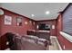 Cozy media room with theater seating and wall-mounted television, perfect for movie nights at 2587 S Flanders Ct, Aurora, CO 80013