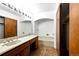 Bathroom featuring an extended vanity with sink and an additional tub/shower stall behind a wall at 6376 Lamar Pl, Arvada, CO 80003