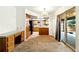 Spacious dining area with sliding glass door access to the outdoor patio at 6376 Lamar Pl, Arvada, CO 80003