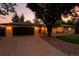 Lovely exterior of a home with a well-maintained lawn, mature tree, and a charming facade at 6376 Lamar Pl, Arvada, CO 80003