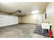 Spacious two-car garage featuring an automatic door, sink, and room for parking at 6376 Lamar Pl, Arvada, CO 80003