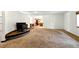 Large living room with a fireplace and easy access to the kitchen area at 6376 Lamar Pl, Arvada, CO 80003