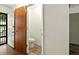 Entryway with access to a powder room with tile flooring, wooden door, and view to the outside at 6376 Lamar Pl, Arvada, CO 80003