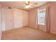 Cozy bedroom with pink walls, carpet floor, and closet offering comfort and functionality at 12114 Melody Dr # 303, Denver, CO 80234