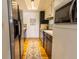 Galley kitchen with stainless steel appliances and convenient floor plan at 12114 Melody Dr # 303, Denver, CO 80234