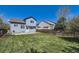 Spacious backyard features a lush lawn, privacy fence, and patio, perfect for outdoor enjoyment at 3734 Licorice Trl, Castle Rock, CO 80109