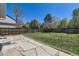 Well-maintained backyard with lush green grass and a charming stone patio area at 3734 Licorice Trl, Castle Rock, CO 80109