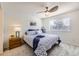 Bright bedroom with a ceiling fan, a large window, and carpet floors at 3734 Licorice Trl, Castle Rock, CO 80109