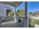 Charming front porch on a sunny day showing railing, supporting posts, and plants at 3734 Licorice Trl, Castle Rock, CO 80109