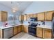 Well-lit kitchen with stainless steel appliances, ample counter space, and modern cabinetry at 3734 Licorice Trl, Castle Rock, CO 80109