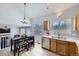 Eat-in kitchen boasts natural light, modern appliances, an island and seating at 3734 Licorice Trl, Castle Rock, CO 80109