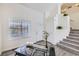 Bright living room featuring stairs, hardwood floors, and neutral decor at 3734 Licorice Trl, Castle Rock, CO 80109