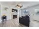 Cozy living room features hardwood floors, fireplace, television, and comfortable seating at 3734 Licorice Trl, Castle Rock, CO 80109