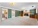 Finished basement showcasing built-in shelving and fireplace at 15895 E 17Th Pl, Aurora, CO 80011