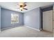 The bedroom features a ceiling fan and a window at 15895 E 17Th Pl, Aurora, CO 80011