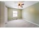 Bright bedroom with ceiling fan and carpet at 15895 E 17Th Pl, Aurora, CO 80011