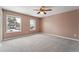 Spacious bedroom with neutral walls and carpet, ceiling fan at 15895 E 17Th Pl, Aurora, CO 80011