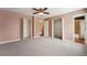 Well-lit bedroom with neutral walls, ceiling fan and closet at 15895 E 17Th Pl, Aurora, CO 80011