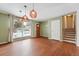 Dining room with wood floors, coat closet and stairway to upper level at 15895 E 17Th Pl, Aurora, CO 80011