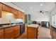 Kitchen with granite countertops, island, and view of living area at 15895 E 17Th Pl, Aurora, CO 80011