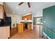 Kitchen with island, stainless steel appliances, and view of living room at 15895 E 17Th Pl, Aurora, CO 80011