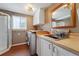 Laundry room with shower, sink, and modern appliances at 15895 E 17Th Pl, Aurora, CO 80011