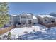 Snow-covered backyard with view of home's exterior at 2959 Skyward Way, Castle Rock, CO 80109