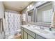 Bathroom with shower, double vanity, and linen closet at 2959 Skyward Way, Castle Rock, CO 80109