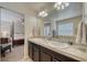 Double vanity bathroom with access to bedroom at 2959 Skyward Way, Castle Rock, CO 80109