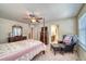 Main bedroom with a post bed, dresser, and an ensuite bathroom at 2959 Skyward Way, Castle Rock, CO 80109