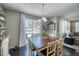 Charming dining room with backyard views and a delightful chandelier at 2959 Skyward Way, Castle Rock, CO 80109