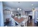 Bright dining area with table and chairs, offering backyard access at 2959 Skyward Way, Castle Rock, CO 80109