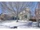 Two-story house with a covered porch and snowy landscaping at 2959 Skyward Way, Castle Rock, CO 80109