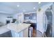 Modern kitchen with granite island and stainless steel appliances at 2959 Skyward Way, Castle Rock, CO 80109