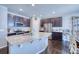 Spacious kitchen with dark cabinetry, granite countertops and stainless steel appliances at 2959 Skyward Way, Castle Rock, CO 80109