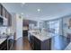 Modern kitchen boasting granite countertops and dark cabinetry at 2959 Skyward Way, Castle Rock, CO 80109