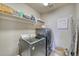 Laundry room with washer, dryer, and shelving at 2959 Skyward Way, Castle Rock, CO 80109