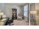 Home office with built-in shelving, comfortable seating, and natural light at 2959 Skyward Way, Castle Rock, CO 80109