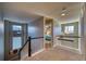 Upper hallway with carpeting, a staircase, and a view into a bedroom at 2959 Skyward Way, Castle Rock, CO 80109