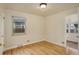 Charming bedroom with hardwood floors, a window, and access to sunroom at 4324 Eaton St, Denver, CO 80212