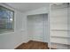 White built-in shelves and hanging rod in spacious closet at 4324 Eaton St, Denver, CO 80212