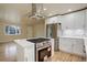 Modern kitchen with stainless steel appliances and white cabinetry at 4324 Eaton St, Denver, CO 80212