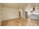 Living room with hardwood floors and open concept to kitchen at 4324 Eaton St, Denver, CO 80212