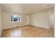 Living room with hardwood floors and bay window at 4324 Eaton St, Denver, CO 80212