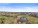 This aerial view highlights walking trails, ponds, greenbelts and neighborhood homes at 5049 Heatherglen Dr, Highlands Ranch, CO 80130
