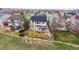 Aerial view of this home with fenced backyard, covered patio and mature trees in the neighborhood at 5049 Heatherglen Dr, Highlands Ranch, CO 80130