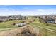 Stunning aerial view showcases the community's serene ponds and walking trails at 5049 Heatherglen Dr, Highlands Ranch, CO 80130